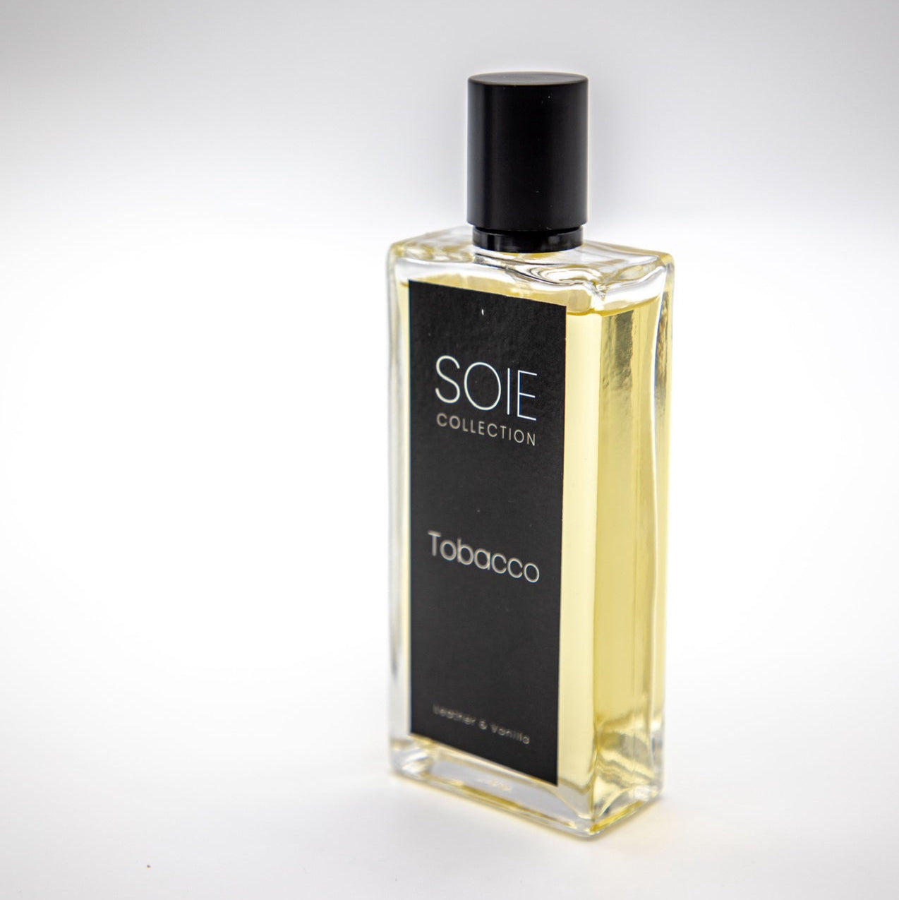 Perfume bottle labeled 'SOIE Collection Tobacco' on a white background